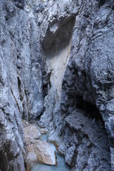 Dramatic mountain canyon with river at Höllentalklamm in the German Alps