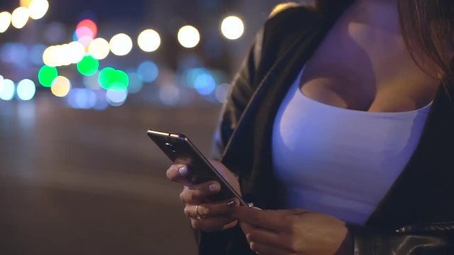 A young girl with a phone in the night city. Big breast. Close Up. Close Up. FHD