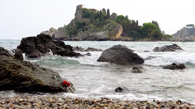 Rocky Shores and Pebble Beach Scene with a Lost Bow Line, Coast of Taormina Italy