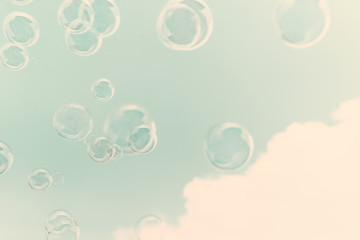 Soap bubbles in the air with cloud and blue sky on background, Outdoor activity funny and party