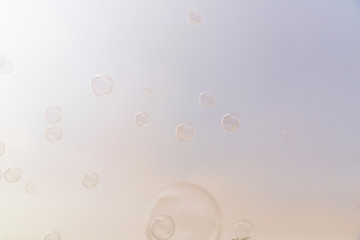 Soap bubbles in the air with cloud and blue sky on background, Outdoor activity funny and party