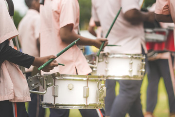 Fototapeta na wymiar Marching band drummers perform in school parade