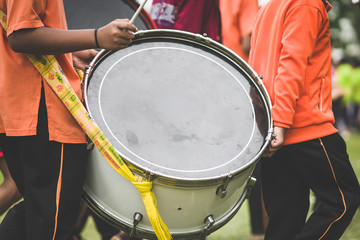 Marching band drummers perform in school parade