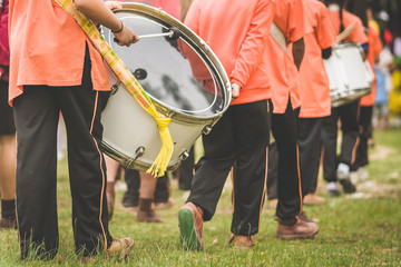 Marching band drummers perform in school parade