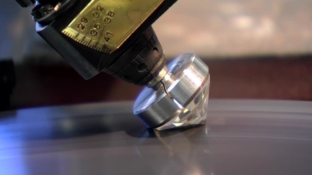 Diamond being shaped on spinning disk.