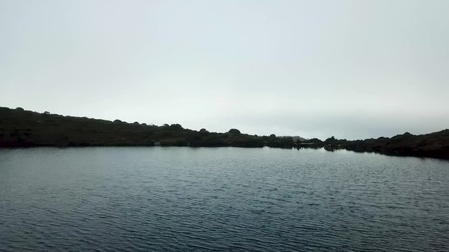 Drone hovering over the water of a Tarn in the Hartz National Park