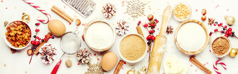 Christmas or New Year composition with ingredients for baking festive cookies, with golden...