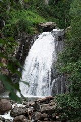 View of the waterfall in the summer forest