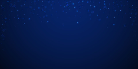 Sparse glowing snow Christmas background. Subtle f