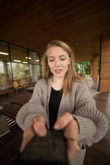 Closeup image of a beautiful woman holding , using and looking at smart phone with feeling happy