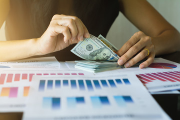 Businessmen are counting the dollar.