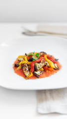 Salad of tomatoes, peppers and roasted aubergine