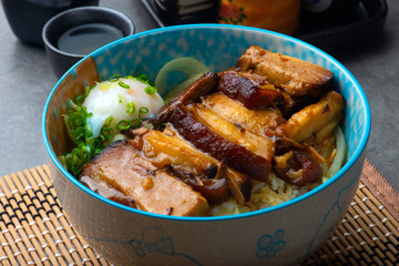 bowl of rice topped with Braised pork belly don