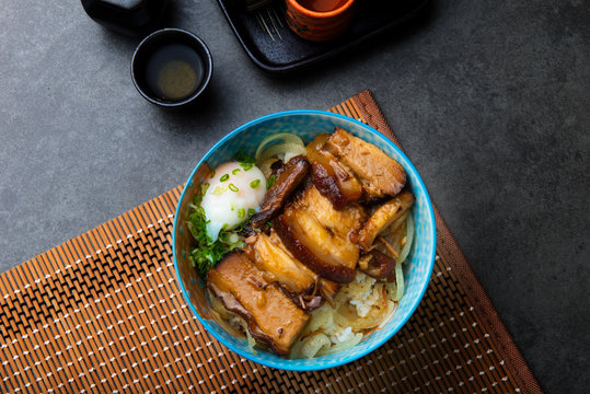 bowl of rice topped with Braised pork belly don