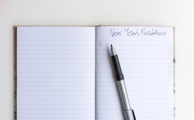 Naklejka premium High angle view of journal with pen and handwritten 
