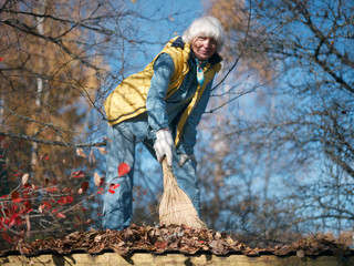 Woman removing withered leaves