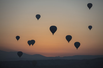 Fototapeta premium Hot air balloon flying over spectacular Cappadocia
