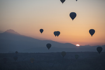 Hot air balloon flying over spectacular Cappadocia