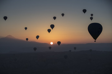 Hot air balloon flying over spectacular Cappadocia