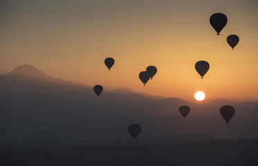 Hot air balloon flying over spectacular Cappadocia