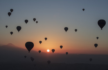 Hot air balloon flying over spectacular Cappadocia