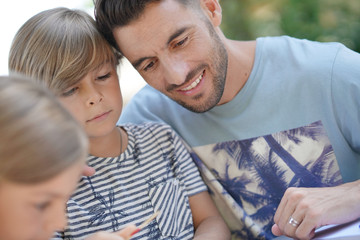 Father and son playing game together