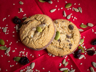 Cookies with seeds on red background