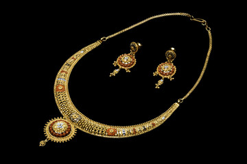 Golden necklace on a black background