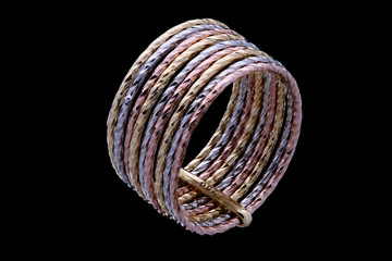 Fototapeta premium Golden ring with three color of gold on a black background