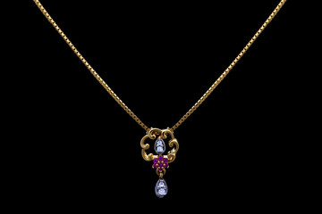 Golden necklace on a black background