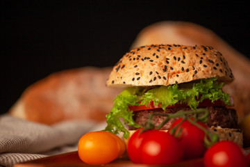 Delicious homemade hamburger with fresh vegetables in the kitchen ready for serve and eat