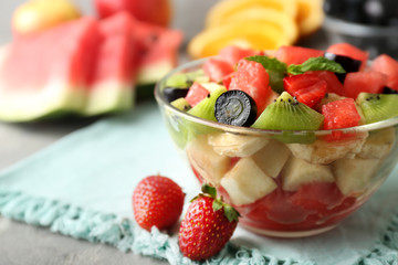 Bowl with delicious watermelon salad on table