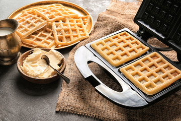 Modern waffle maker with ingredients on grey table - obrazy, fototapety, plakaty