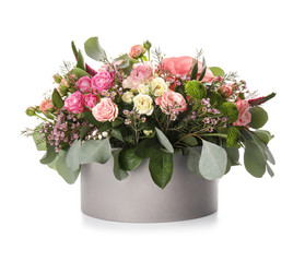 Gift box with beautiful flowers on white background