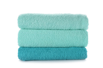 Fototapeta na wymiar Stack of clean soft towels on white background