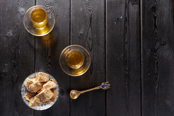 Tasty halva with tea on the table