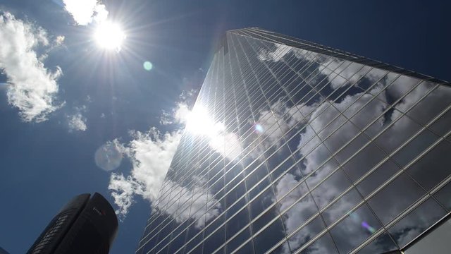 Clouds Reflected on Modern Office Corporation Glass Building