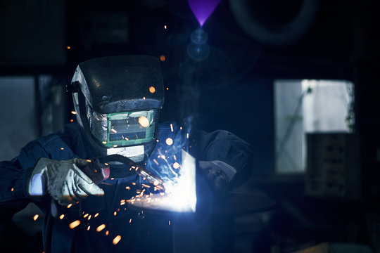Man welding in workshop