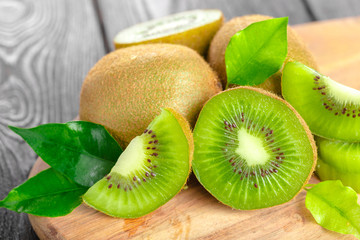 Juicy kiwi fruit on wooden table