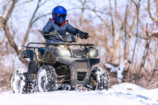 Travel in the winter on the ATV. Beautiful winter nature.