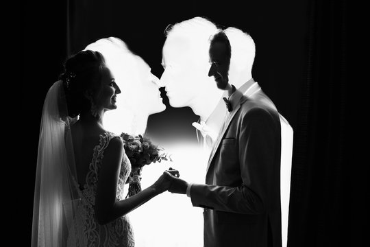 Wedding couple. Multi exposition effect, silhouete of bride and groom. Creative black and white art wedding photo