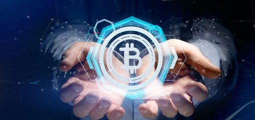 Plakat Man holding a technology Bitcoin icon on a circle 3d rendering