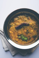 Dal Tadka Fry / Indian Lentil Curry served in a bowl with rice and roti, selective focus