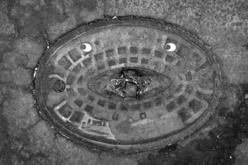 Isolated sewer cover with a comic twist