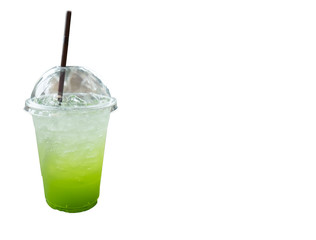 Cold drink of green in plastic glass on isolated white.