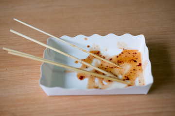 Sweet spicy sauce stains in takeaway box