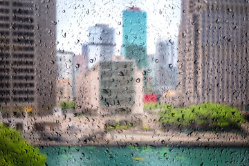 View on Chicago downtown through the window of cafe with rain drops. Chicago downtown and skyscrapers, Illinois, USA 