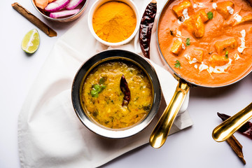 Indian Lunch / Dinner main course food in group includes Paneer Butter Masala, Dal Makhani, Palak Paneer, Roti, Rice etc, Selective focus