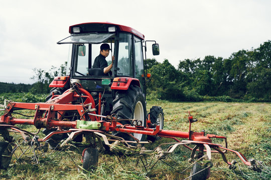 Farmer in tractor in field