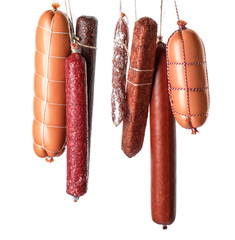 Different kinds of sausages on white background